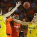 Michigan freshman Mitch McGary fights Syracuse junior C.J. Fair for a loose ball during the second half at the Final Four in Atlanta on Saturday, April 6, 2013. Melanie Maxwell I AnnArbor.com